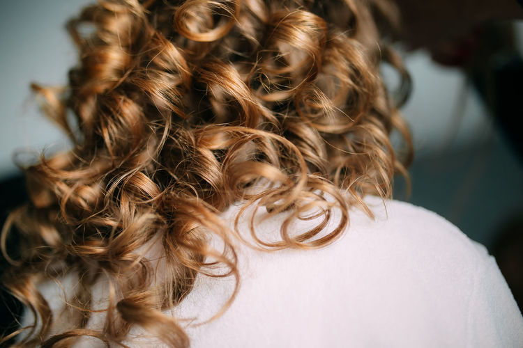 Rear view of woman with curly hair