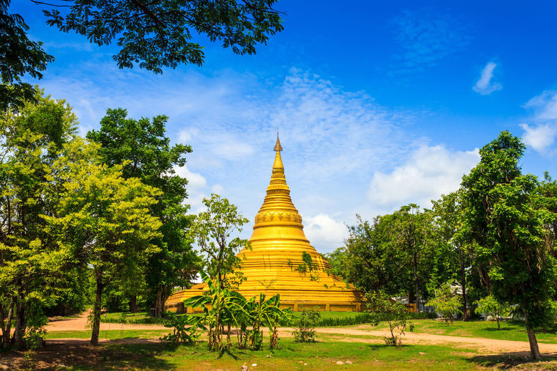 View of temple building against cloudy sky