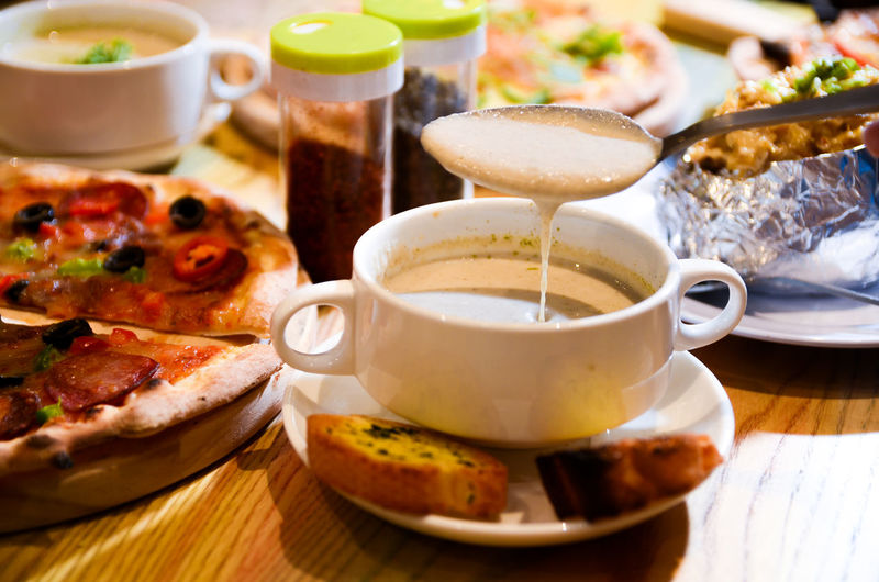 Close-up of coffee and food on table