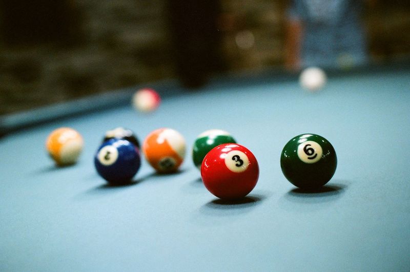 Multi colored snooker balls on table