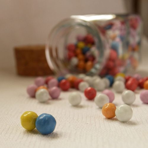 Close-up of candies spilling from jar