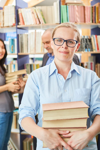 Midsection of woman reading book