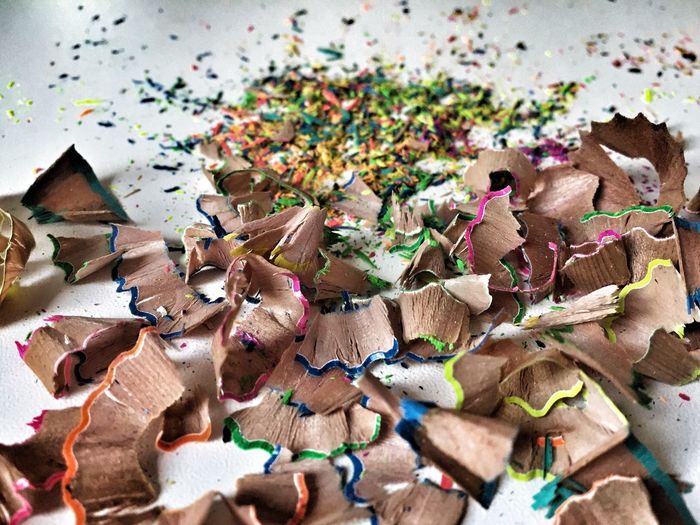 High angle view of color pencils shavings