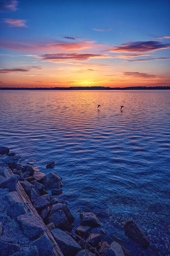 Scenic view of sea against sky during sunset