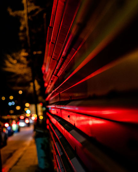 Close-up of red shutter at night
