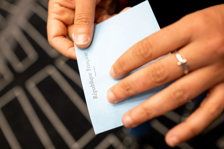 Cropped hand of person holding envelop