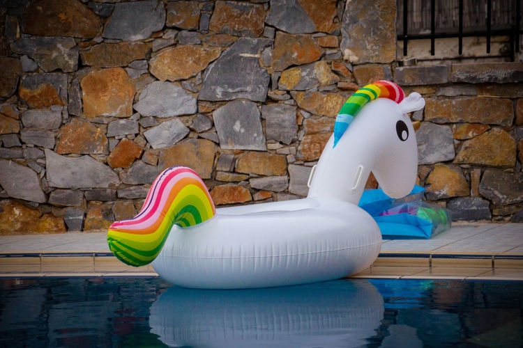 Rainbow unicorn at the pool in the morning