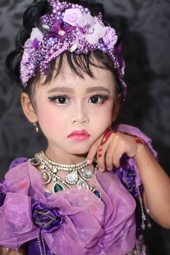 Portrait of cute girl wearing make-up