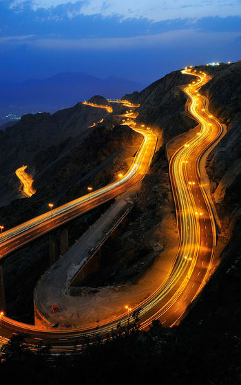 High angle view of curved illuminated road