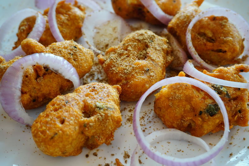 Fried food with onion on plate