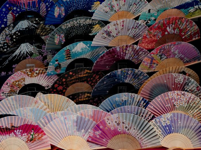 Full frame shot of colorful hand fans for sale in market