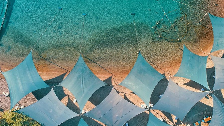 Aerial view of canvas roofs at seashore