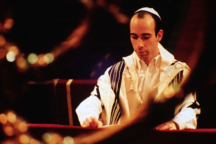 Rabbi reading book at synagogue