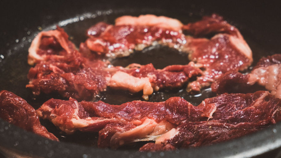 Close-up of meat in cooking utensil
