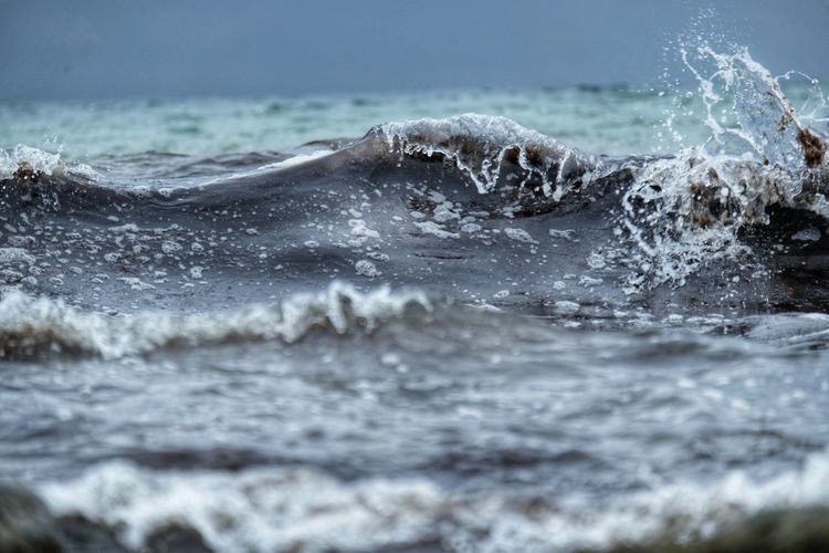 Sea waves splashing on shore