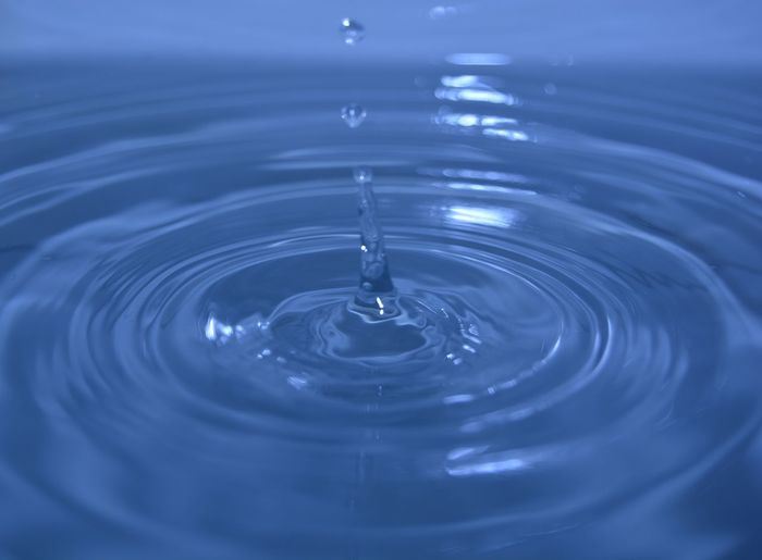 Close-up of drop splashing in water
