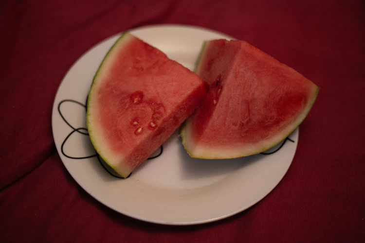 High angle view of fruits in plate on table
