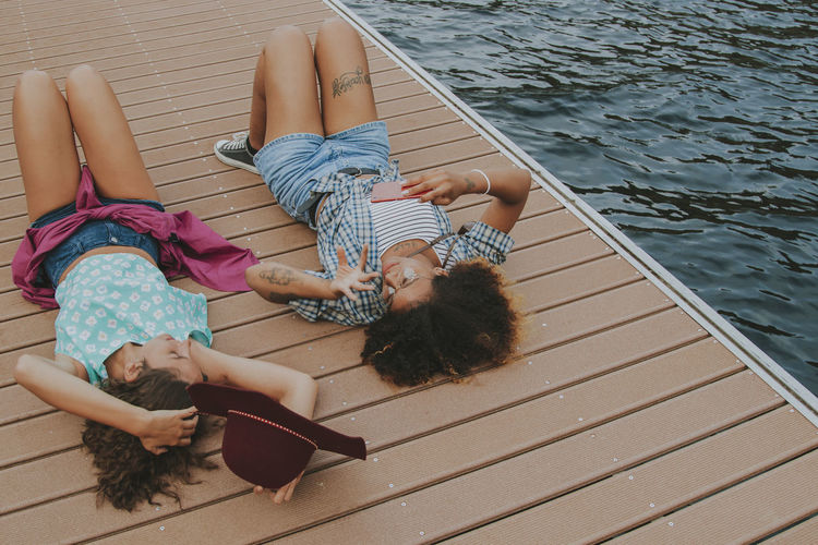 Low section of woman sitting in boat