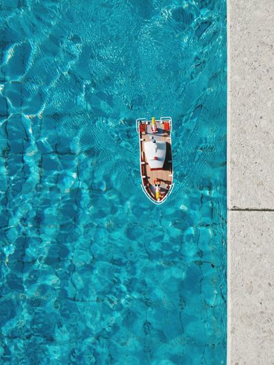 High angle view of toy boat in swimming pool