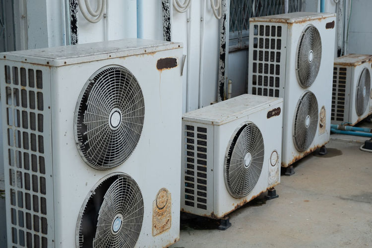 Air conditioners on footpath