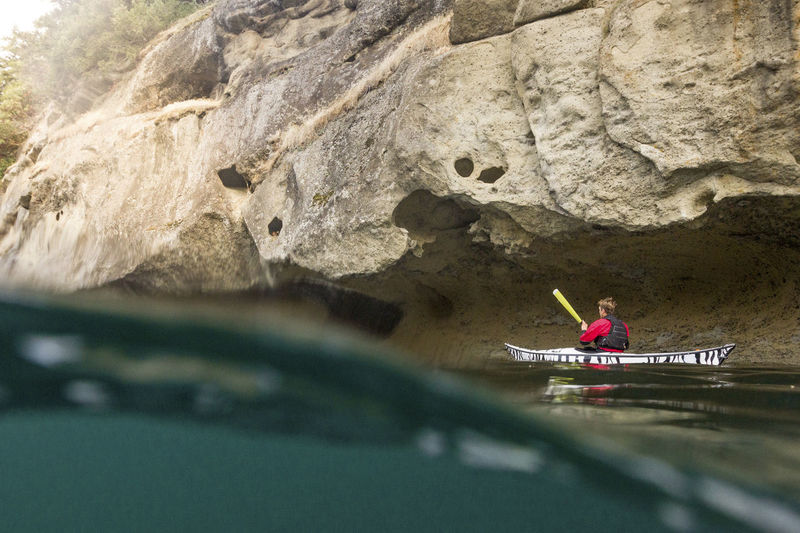 Water surface level of man kayaking over river
