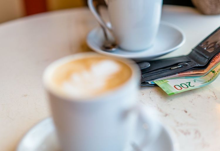 Close-up of russian currency roubles in wallet on table in cafe