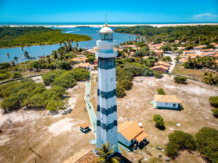 High angle view of lighthouse amidst buildings