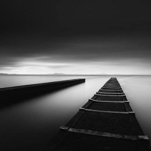 Long exposure shot of jetty and dramatic clouds, lake biwa, shiga prefecture, japan
