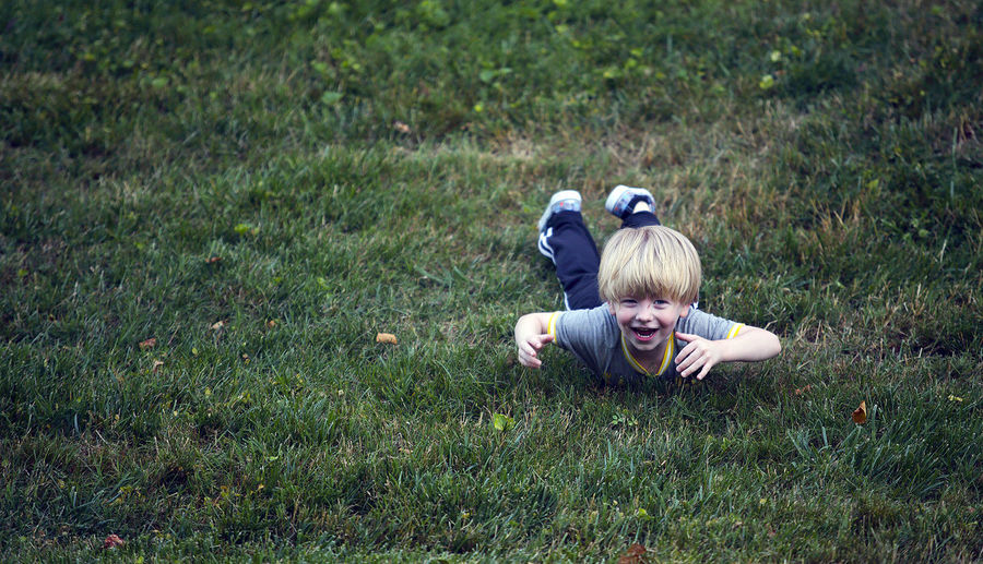 Boy playing on grass