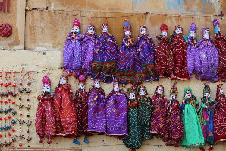 Traditional puppets against wall at market