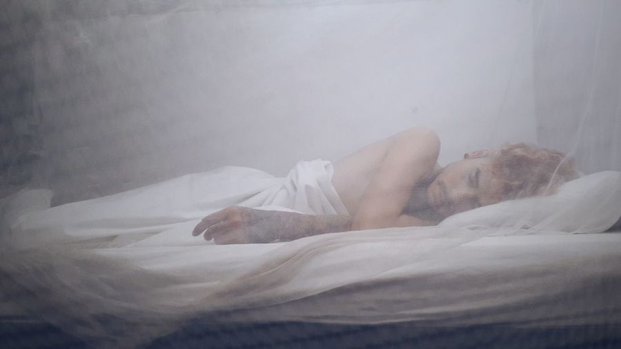 Man lying on bed