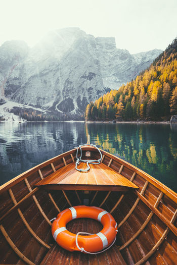 Boat on lake against mountain
