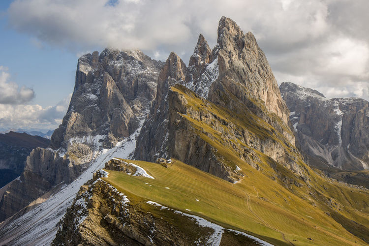 Seceda ridge in autumn with early snow in dolomites italy