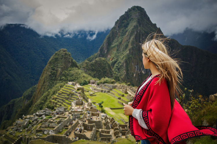 Woman standing against mountains