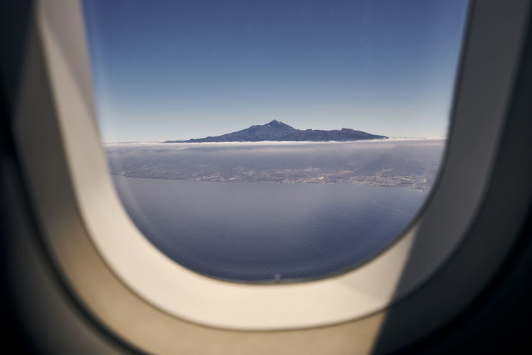 Aerial view from airplane window. volcano teide on tenerife at sunny day. canary islands, spain.