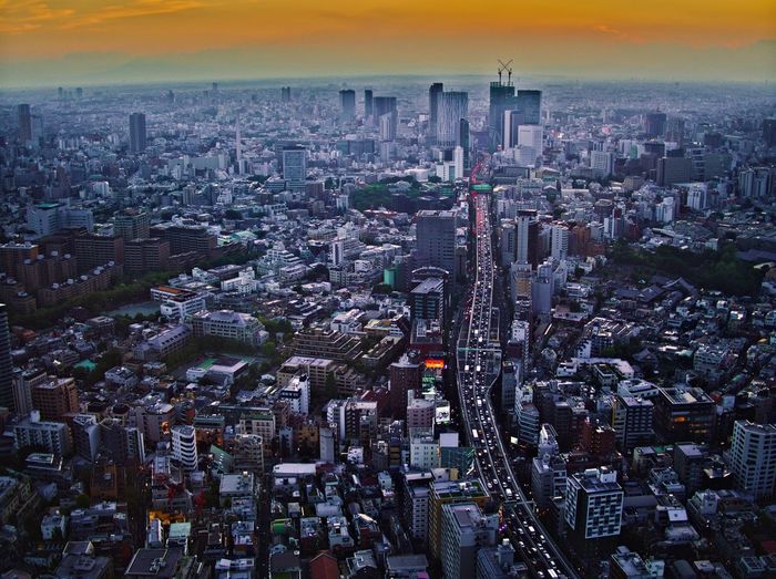 High angle view of modern buildings in city against sky