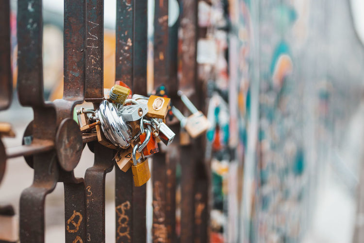 Close-up of padlocks hanging on metal