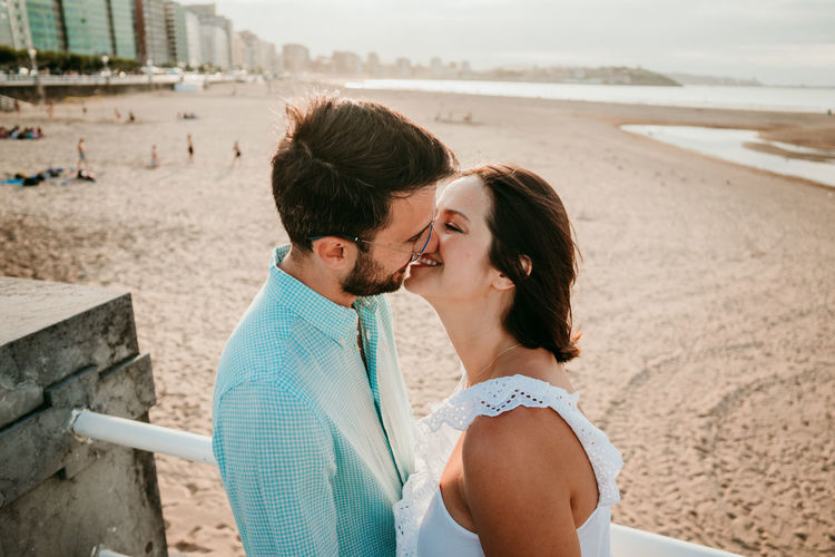Young couple kissing on beach