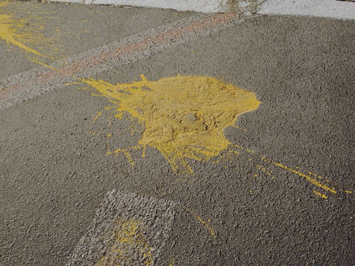 Close-up of yellow road marking on street