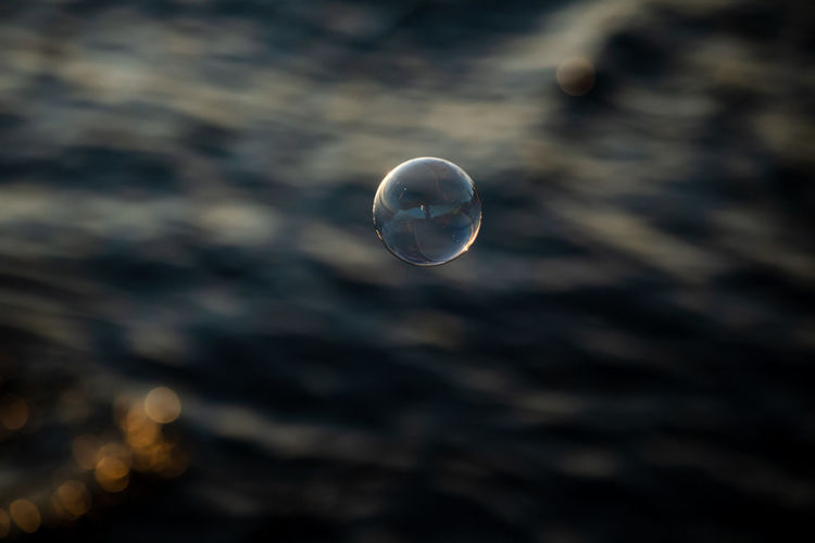 Close-up of bubbles against sea