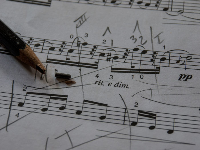 Close-up of musical note with broken pencil tip