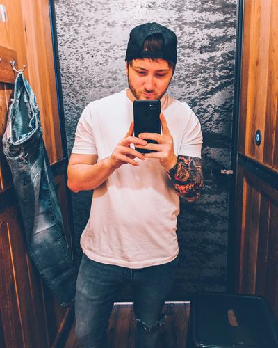 Man taking selfie in dressing room