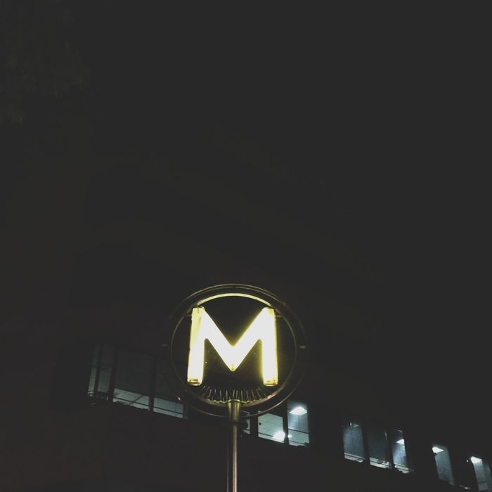 Illuminated sign with letter m