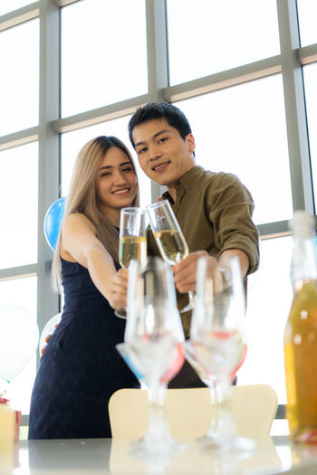 Young couple with drink on table