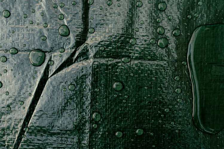 Full frame shot of wet tarpaulin