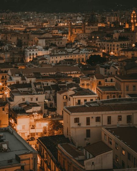 High angle view of illuminated town in city