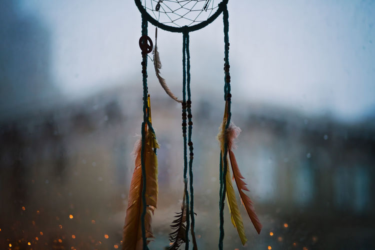 Handmade dreamcatcher, made by husband, hanging in our window on a another rainy evening