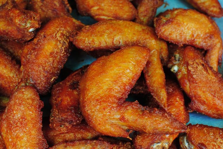 High angle view of fried chicken wings
