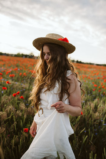 Beautiful woman standing on field