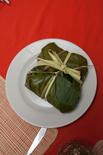 High angle view of leaves in plate on table